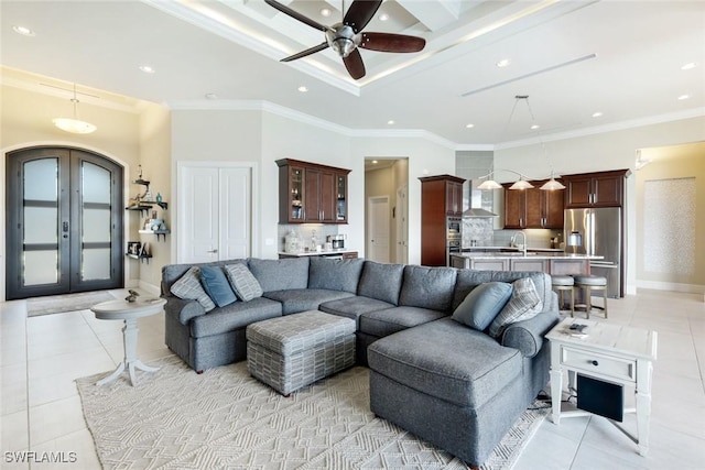 living area featuring crown molding, baseboards, light tile patterned floors, recessed lighting, and french doors