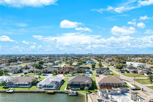 aerial view featuring a residential view and a water view