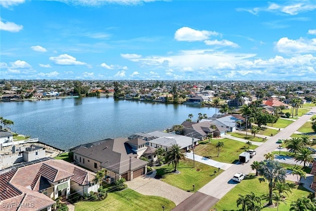 birds eye view of property with a residential view and a water view