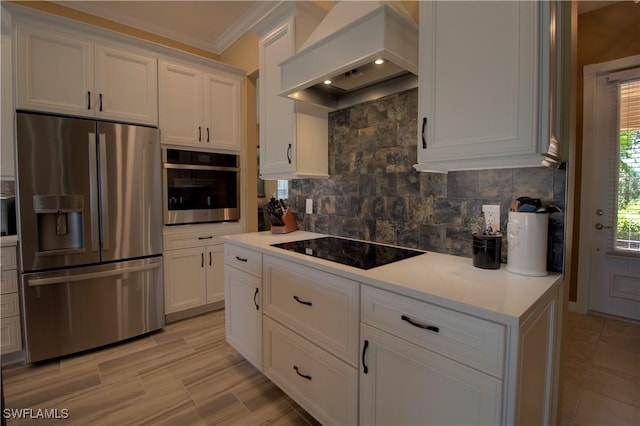 kitchen featuring custom exhaust hood, backsplash, stainless steel appliances, and light countertops