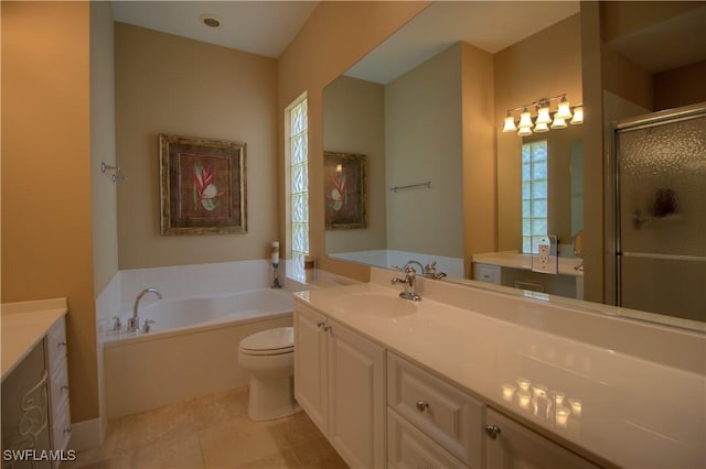 full bathroom featuring vanity, tile patterned floors, a bath, and a stall shower