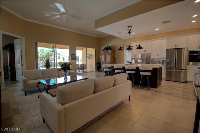 living room featuring crown molding, recessed lighting, a ceiling fan, and visible vents