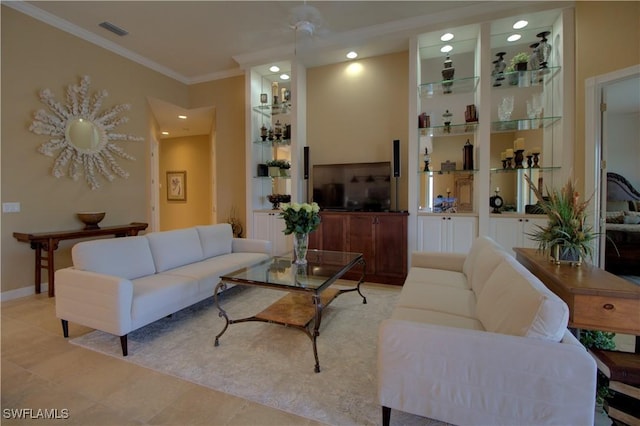 living room featuring visible vents, built in shelves, light tile patterned flooring, crown molding, and baseboards