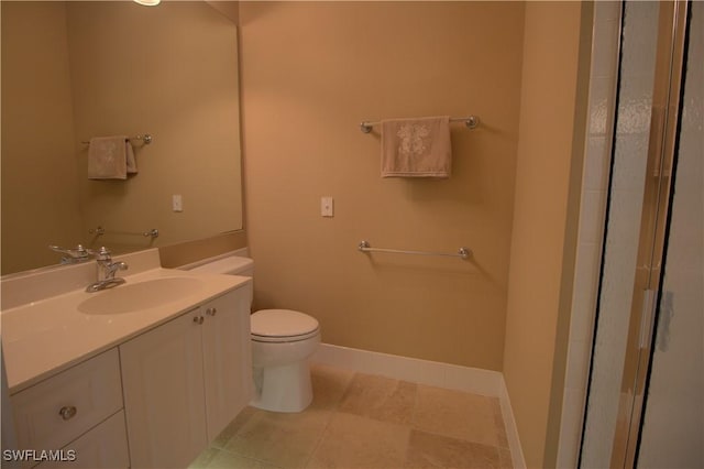 full bathroom featuring tile patterned floors, toilet, vanity, and baseboards