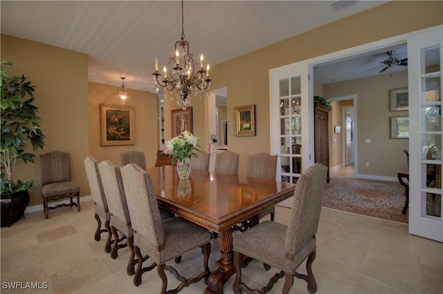 dining space with baseboards and a notable chandelier