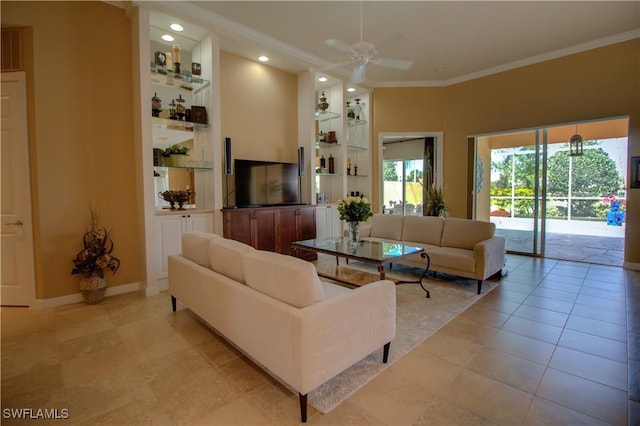 living room with ornamental molding, a ceiling fan, recessed lighting, light tile patterned floors, and baseboards