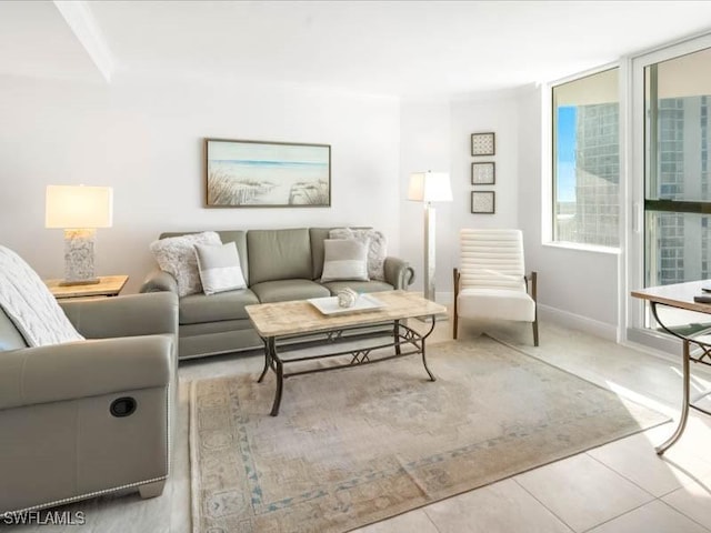 living room with tile patterned floors and baseboards