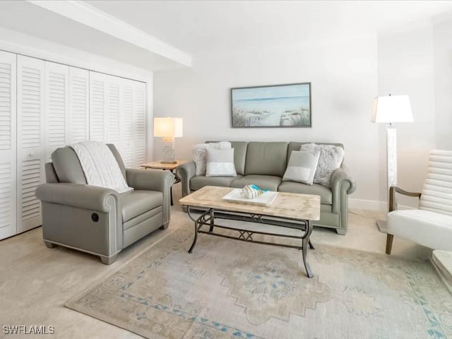 living room featuring baseboards and carpet floors