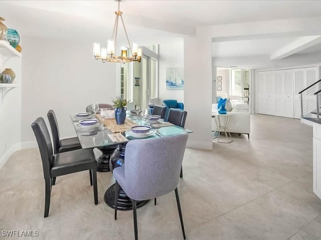 dining room with baseboards, an inviting chandelier, and stairs