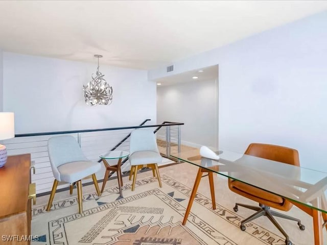 home office featuring visible vents, baseboards, and an inviting chandelier