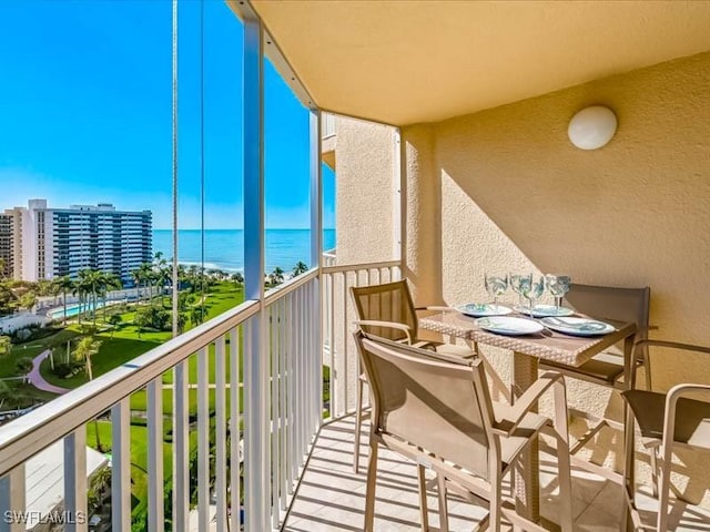 balcony featuring a water view