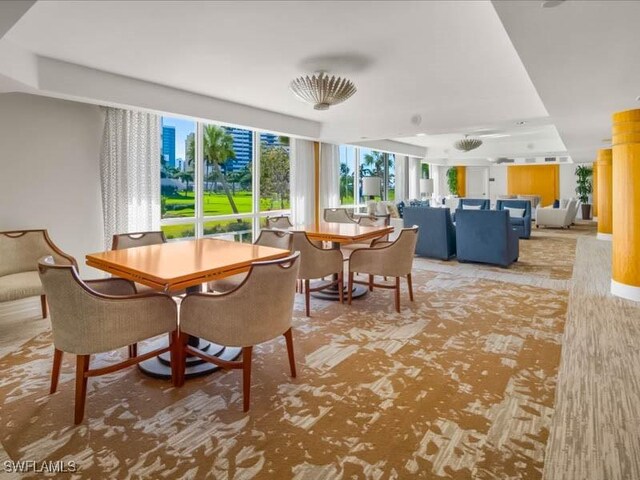 dining space with a tray ceiling