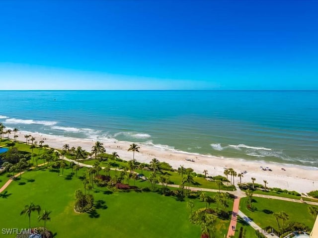 birds eye view of property featuring a view of the beach and a water view