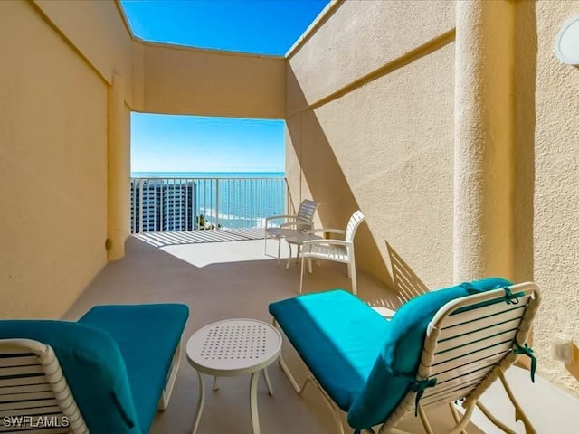 balcony featuring a water view