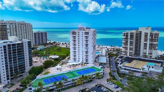 drone / aerial view with a city view and a water view