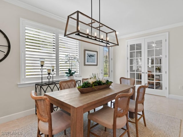 dining room with french doors, baseboards, light tile patterned flooring, and crown molding