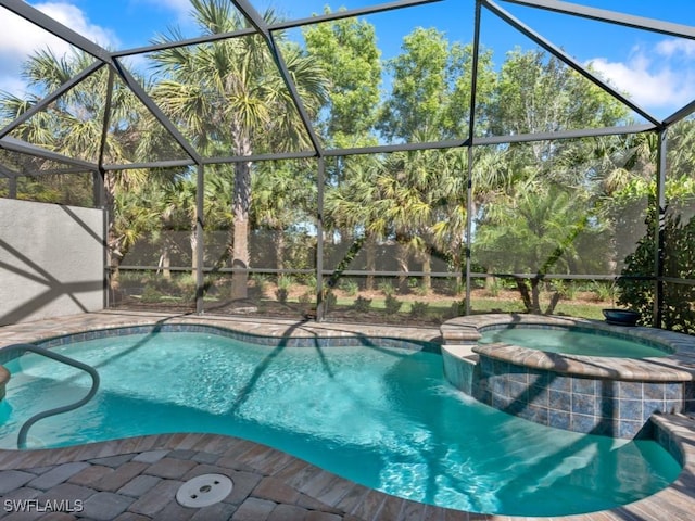 view of swimming pool with a lanai, a patio area, and a pool with connected hot tub