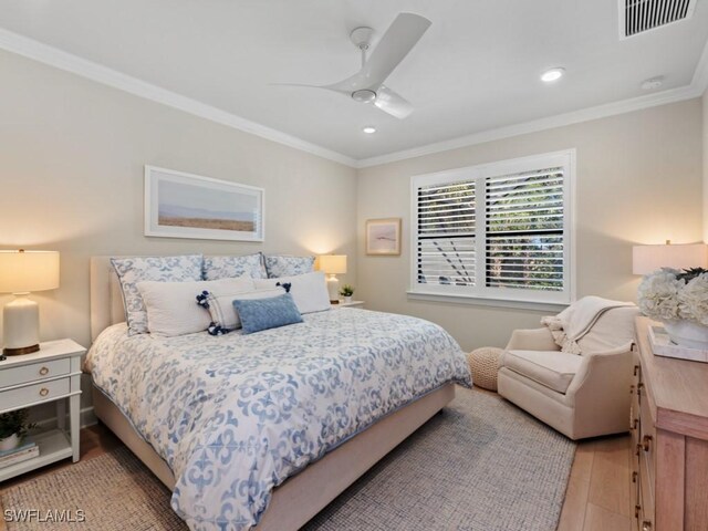 bedroom featuring light wood finished floors, visible vents, crown molding, ceiling fan, and recessed lighting