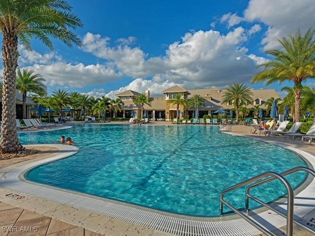 community pool with a patio area