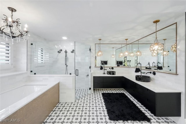 full bath featuring vanity, a garden tub, tile walls, and a stall shower