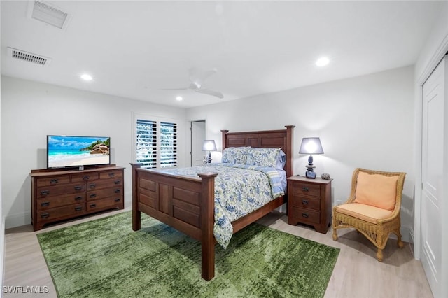 bedroom with a ceiling fan, recessed lighting, visible vents, and light wood-type flooring