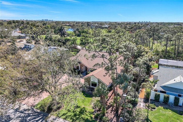 drone / aerial view with a view of trees