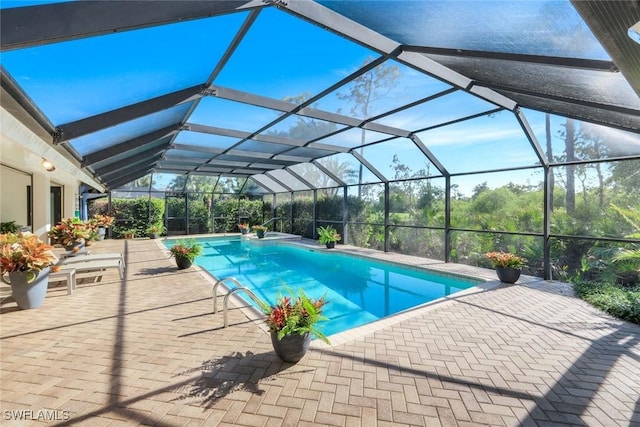 outdoor pool featuring a lanai and a patio area