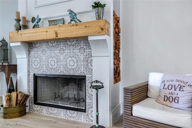 details featuring a tile fireplace