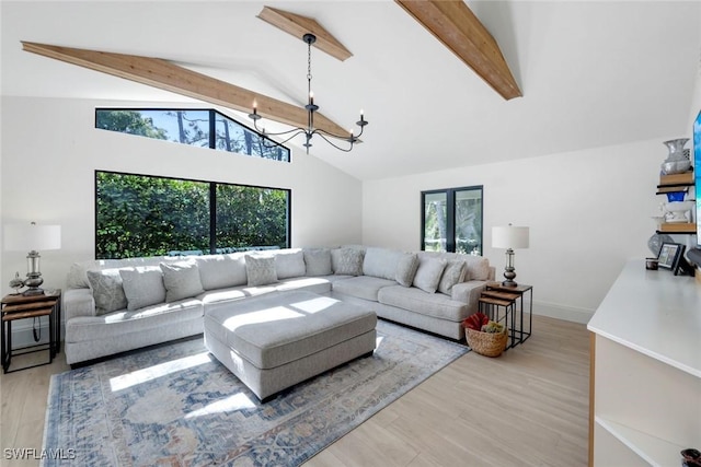 living area with wood finished floors, baseboards, high vaulted ceiling, beam ceiling, and a chandelier