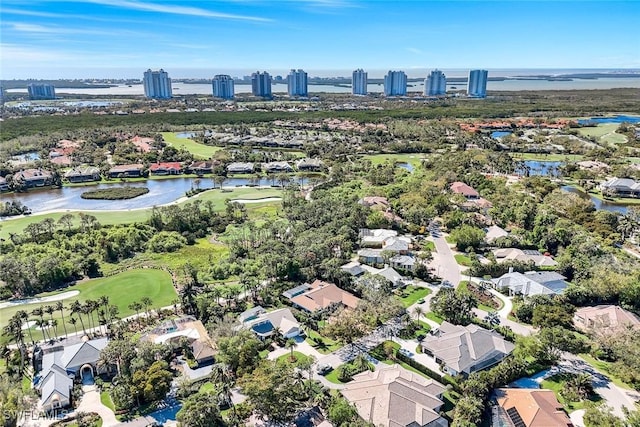 bird's eye view featuring a water view and view of golf course