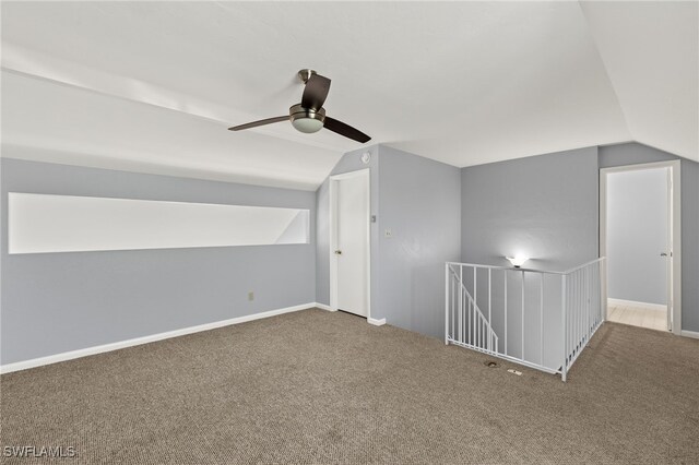 bonus room featuring baseboards, lofted ceiling, and carpet