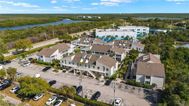 drone / aerial view with a residential view and a water view