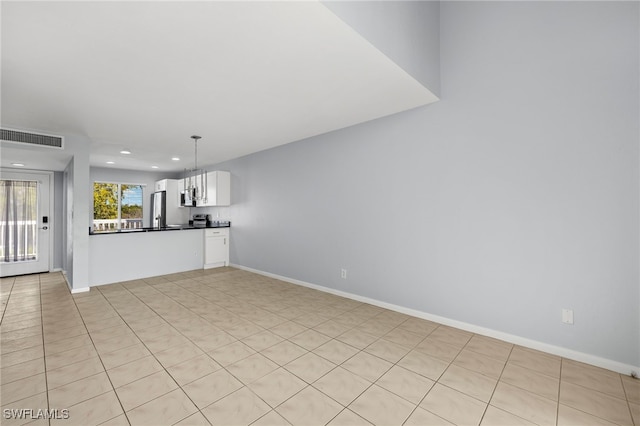 unfurnished living room with recessed lighting, visible vents, and baseboards