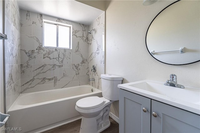 full bath featuring vanity, wood finished floors, toilet, and washtub / shower combination