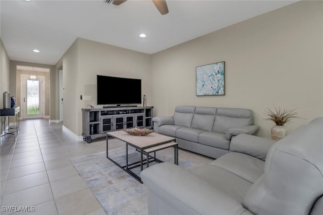 living room featuring light tile patterned flooring, recessed lighting, baseboards, and ceiling fan