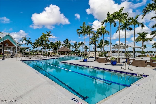 community pool with a patio area