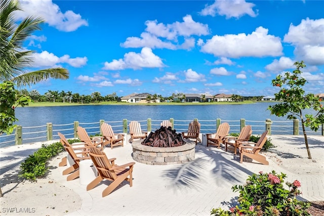 property view of water featuring an outdoor fire pit