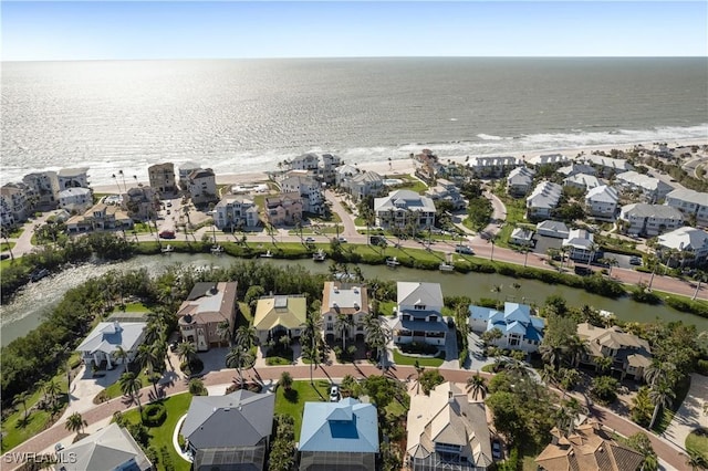 birds eye view of property with a residential view and a water view