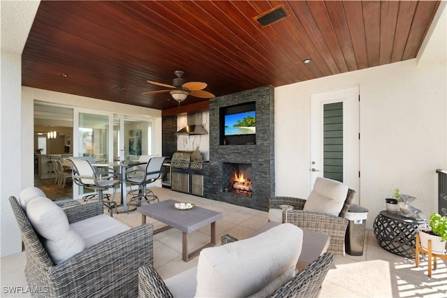 view of patio / terrace with grilling area, visible vents, ceiling fan, an outdoor living space with a fireplace, and outdoor dining space