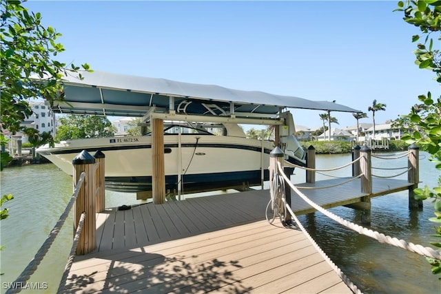 view of dock with a water view and boat lift