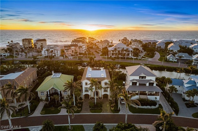 bird's eye view with a residential view and a water view