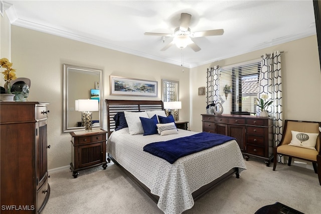 bedroom with ceiling fan, light carpet, and ornamental molding