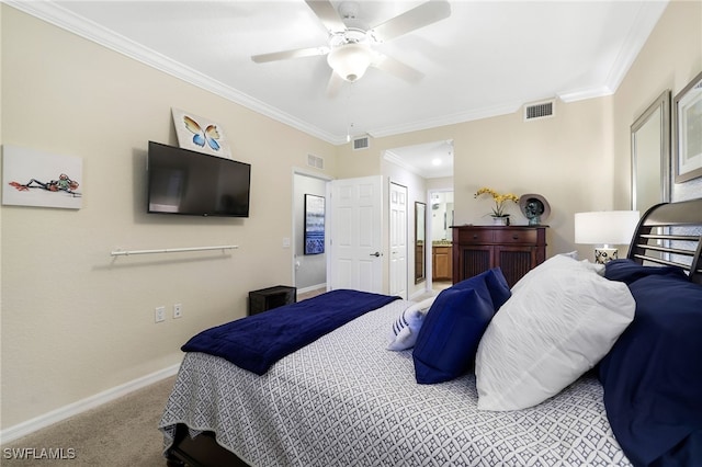 carpeted bedroom with connected bathroom, baseboards, visible vents, and ornamental molding