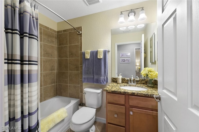 full bathroom featuring visible vents, toilet, a textured wall, shower / bath combination with curtain, and vanity