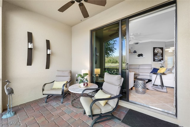 view of patio featuring visible vents and a ceiling fan