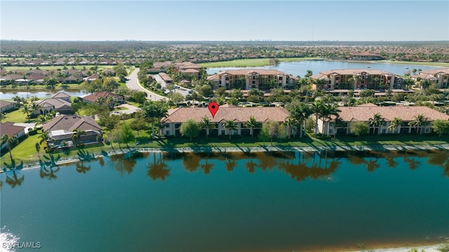 bird's eye view with a residential view and a water view