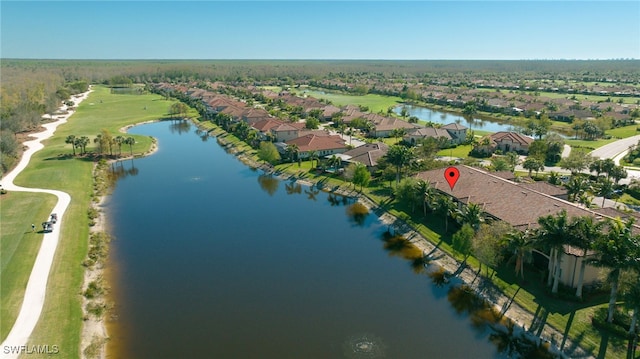 aerial view with a residential view and a water view