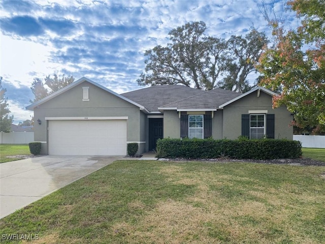 ranch-style home featuring stucco siding, concrete driveway, a front yard, and a garage