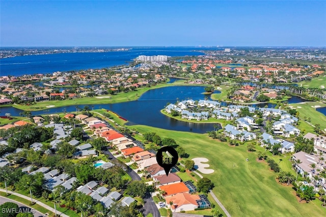 bird's eye view featuring view of golf course, a water view, and a residential view