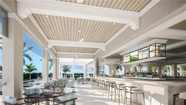 interior space featuring outdoor dry bar, a ceiling fan, and outdoor dining space